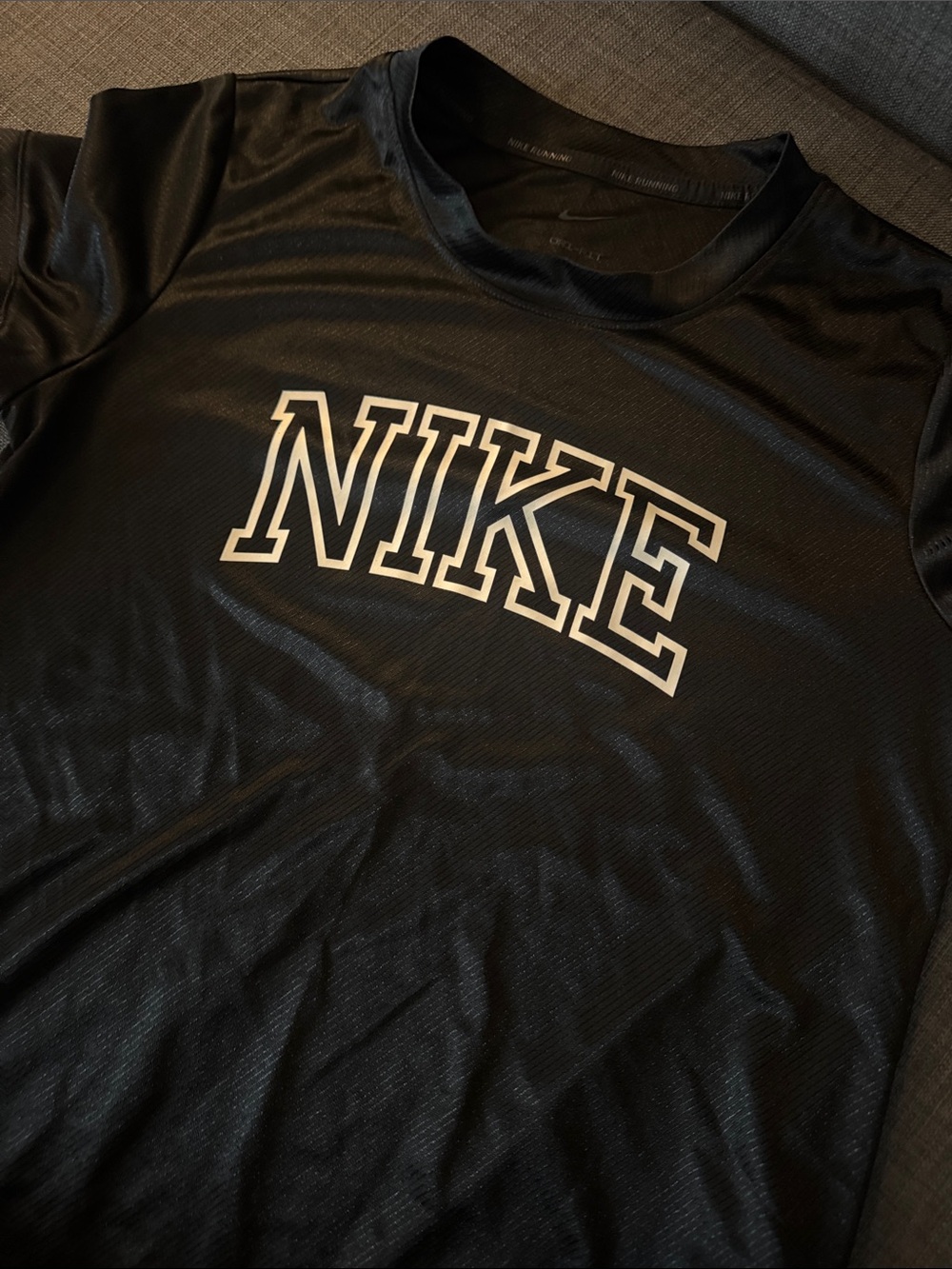 Nike Black Short-Sleeve Athletic Tee with White Outline Logo